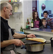 Students watching crepe cooking